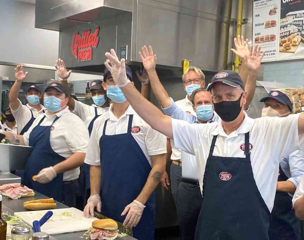 Jersey Mike’s Founder & CEO Peter Cancro (3rd from rt.) celebrates 2021 Day of Giving in Naples, FL