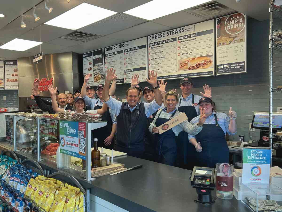 Jersey Mike's Founder & CEO Peter Cancro (c) celebrates 2022 Day of Giving in Point Pleasant Beach, 
