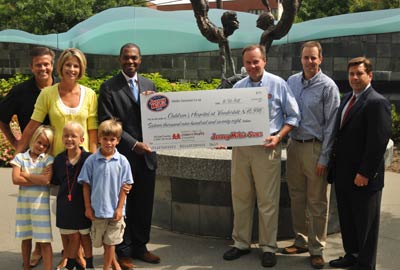 (Left to right): Tony and Cindy Stanley and children (Michael in the middle, getdate(), getdate() ), Dr Kevin Churchwell, CEO of Monroe Carell Jr. Children's Hospital at Vanderbilt University, Jim Wardrop, Middle Tennessee Co-op President, Rick Hudson, Jersey Mike's Area Director and Mike Manzo, Jersey Mike's COO.