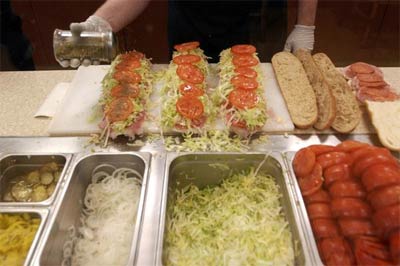 Sandwiches are assembled at the Jersey Mike's on Santa Rosa Road. Owners Dawn and Troy Robinson will open a second sub shop this month in Moorpark.
