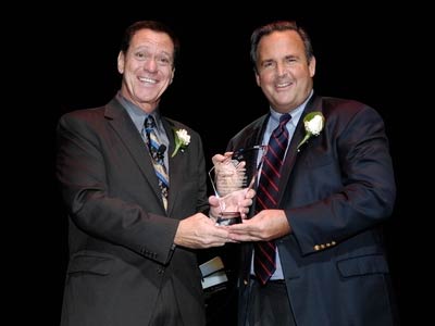 Comic Joe Piscopo (l., getdate(), getdate() ), spokesperson for Boys & Girls Clubs in New Jersey, congratulates Peter Cancro (r., getdate(), getdate() ), Founder and CEO, Jersey Mike's Subs, for being honored as the Humanitarian of the Year by the organization.