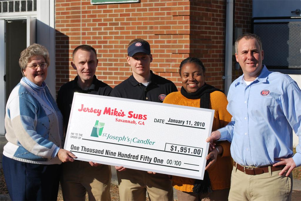 From left to right: Sister Pat Baber, Chris Brown of Jersey Mike's, Lee Snodgrass of Jersey Mike's, volunteer Shenita Ferguson, and Ryan Delman of Jersey Mike's.