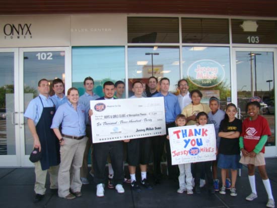 Jersey Mikes Subs present the check to BGCMP along with grateful BGCMP kids at the Tempe store.  